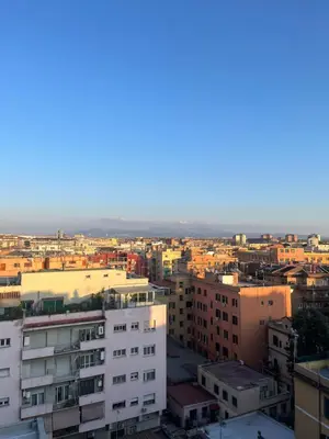 an aerial view of a city with buildings at Panoramic penthouse 10m from metro A in Rome