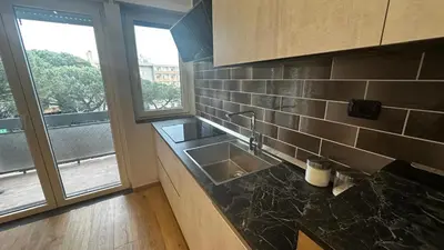 a kitchen counter with a sink and a window at Dolce Sosta Vatican Home close to St Peter's in Rome