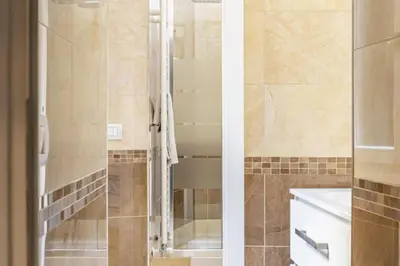 a bathroom with a shower and a sink at Stradivari in Rome