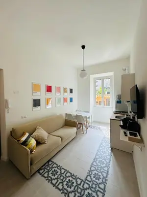 a living room with a couch and a table at Gattamelata in Rome