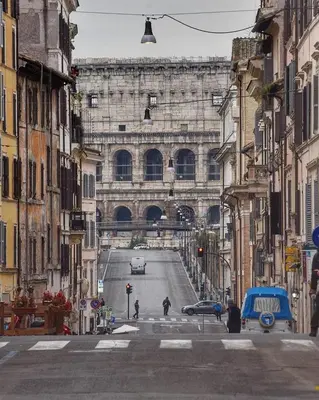 a large building in the middle of a street at COLOSSEUM Studio Flat in Rome