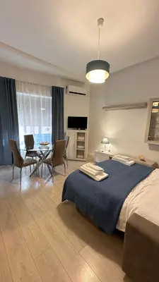 a bedroom with a bed and a table and chairs at Vatican YH in Rome