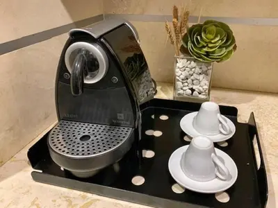 a toaster sitting on top of a counter with dishes at San LoFt in Rome