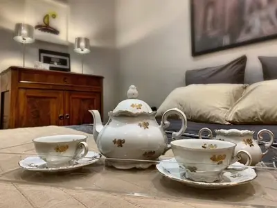 a tea set on a table in a living room at San LoFt in Rome