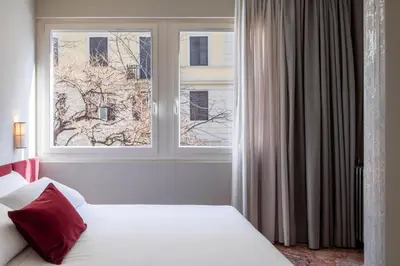 a bedroom with a bed and a window at ATEL Guest House in Rome