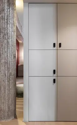 a room with white cabinets and a wall at ATEL Guest House in Rome