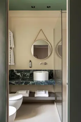 a bathroom with a sink and a mirror at ATEL Guest House in Rome