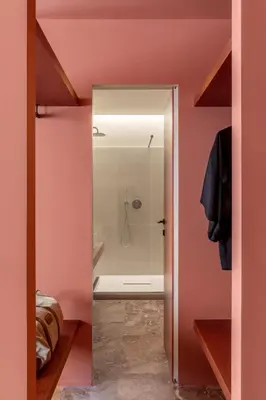 a bathroom with pink walls and a walk in shower at ATEL Guest House in Rome