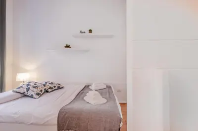 a bedroom with a bed with towels on it at Bibi Home - Vaticano in Rome