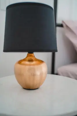a wooden lamp sitting on top of a table at Domus Iulia, Trastevere in Rome