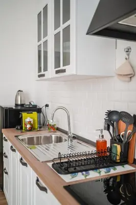 a kitchen counter with a sink and a stove top oven at Domus Iulia, Trastevere in Rome