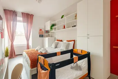 a small bedroom with a bed in a room at Luxe Escape Colosseo in Rome