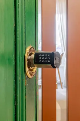 a remote control sticking out of a door at Luxe Escape Colosseo in Rome