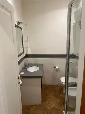a bathroom with a sink and a toilet at Deluxe Spanish Steps in Rome