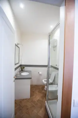 a bathroom with a toilet and a sink at Deluxe Spanish Steps in Rome