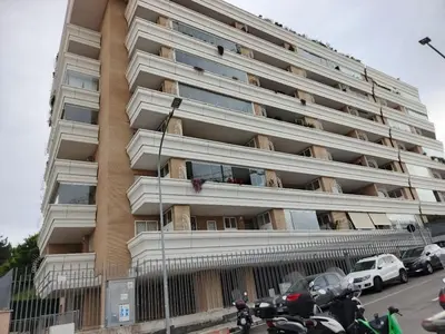 a tall apartment building with motorcycles parked in front of it at Daniela Luxury Apartment in Rome