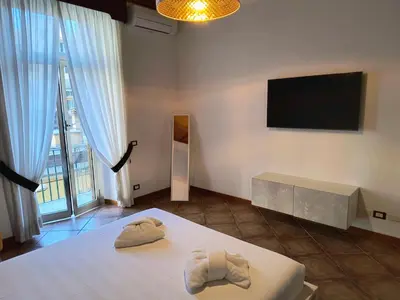 a room with a bed with two towels on it at The Apartment in Rome