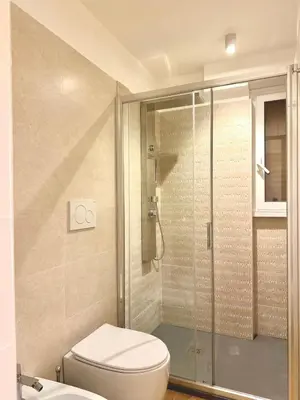 a bathroom with a toilet and a shower at Maryam Vatican Suites in Rome