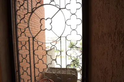 a glass window with a view of a garden at Margherita Holiday Home in Rome