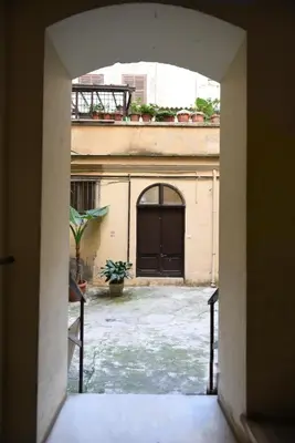 an open doorway to a building with a door at Appartamento San Lorenzo di Massimo & Luisa in Rome