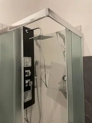 a shower with a glass door in a bathroom at Appartamento San Lorenzo di Massimo & Luisa in Rome