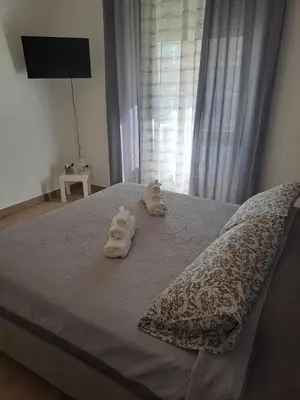 a bed with towels on it with a window at 102 DreamHouse metropolitana B Libia in Rome