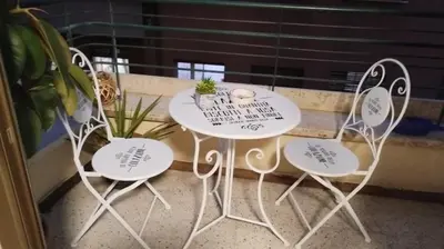 a table and two chairs with writing on them at 102 DreamHouse metropolitana B Libia in Rome