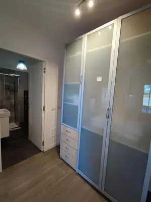 a bathroom with a large glass closet with a sink at Roberta and Luca cozy apartment with garden, terrace and pool in Rome