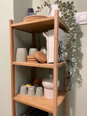 a wooden shelf with cups and other items on it at Mazzini ApartmenT, next to Vatican City in Rome