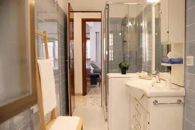 a bathroom with a sink and a shower at A Casa di Rocco in Rome