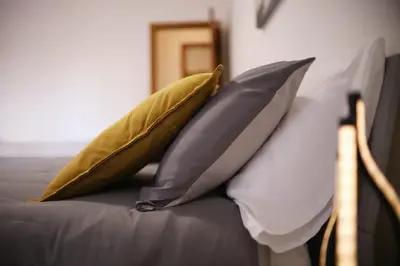 two pillows sitting on top of a bed at A Casa di Rocco in Rome
