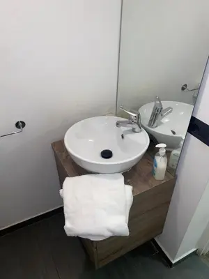 a bathroom with a white sink and a mirror at Piazza NAVONA - CAMPO dei FIORI in Rome