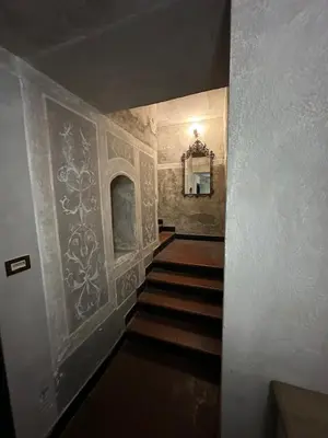 a hallway with a staircase in a building at Piazza NAVONA - CAMPO dei FIORI in Rome