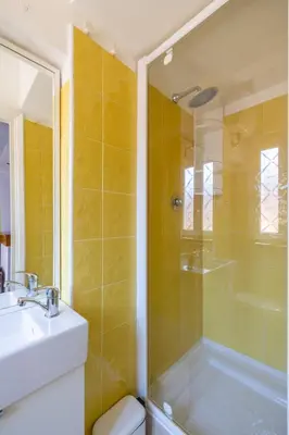 a bathroom with a shower and a sink and a toilet at Fascinating attic - up to 2 guests - Trastevere in Rome