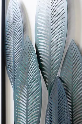 a group of green leaves on a wall at Thelma House - lovely apartment near Tiburtina Station in Rome