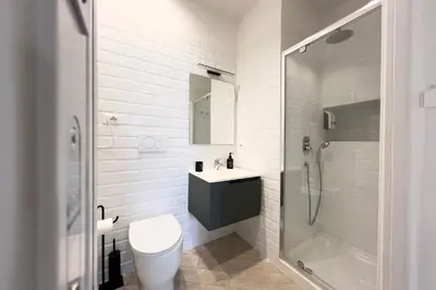 a bathroom with a toilet and a shower and a sink at Thelma House - lovely apartment near Tiburtina Station in Rome