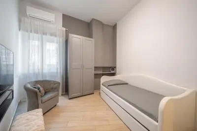 a hospital room with a bed and a chair at Thelma House - lovely apartment near Tiburtina Station in Rome