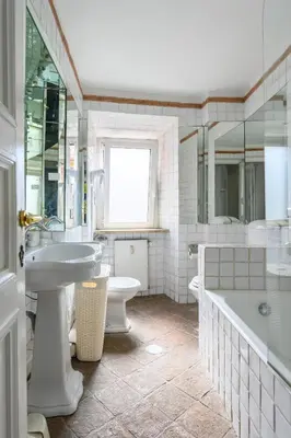 a bathroom with a sink and a tub and a toilet at Historic Center - Navona Luxe Haven - Elevator, Soundproof & Netflix in Rome