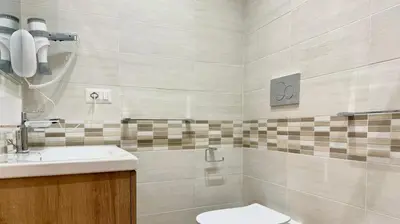 a bathroom with a sink and a toilet at Chich Suites in the Heart of Historic Rome in Rome