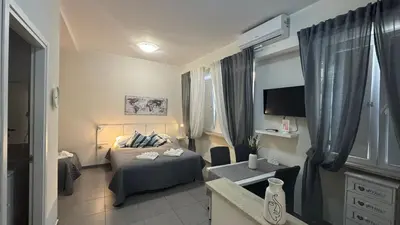 a bedroom with a bed and a tv in a room at Gemelli tre in Rome