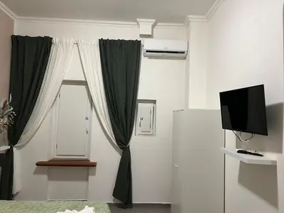a living room with a window and a television at Gemelli tre in Rome
