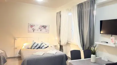 a bedroom with two beds and a tv and a window at Gemelli tre in Rome