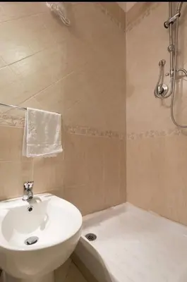 a bathroom with a sink and a toilet and a tub at Rome Studio Centro Storico in Rome