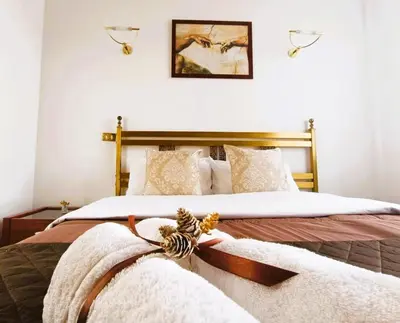 a bedroom with a large bed with white sheets and pillows at Home Relax Appia San Giovanni in Rome