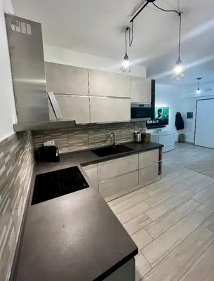 a kitchen with a sink and a counter top at Elegant & Spacious 2BR 2BA Unit with Private Patio in Rome