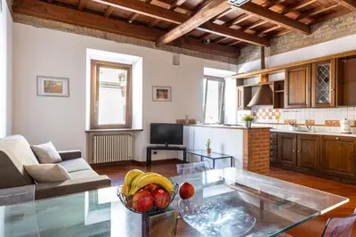 a living room with a table with fruit on it at La Grande Casa - City Center in Rome
