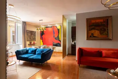 a living room with a couch and a table at SAN GIACOMO 22 Luxury House in Rome