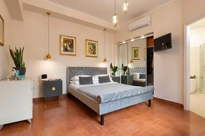 a bedroom with a large bed in a room at SAN GIACOMO 22 Luxury House in Rome