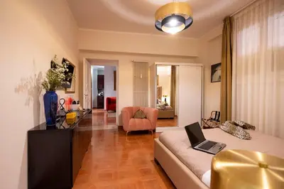 a living room with a couch with a laptop on it at SAN GIACOMO 22 Luxury House in Rome
