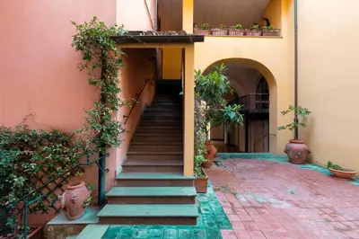 an entrance to a building with stairs and plants at SAN GIACOMO 22 Luxury House in Rome